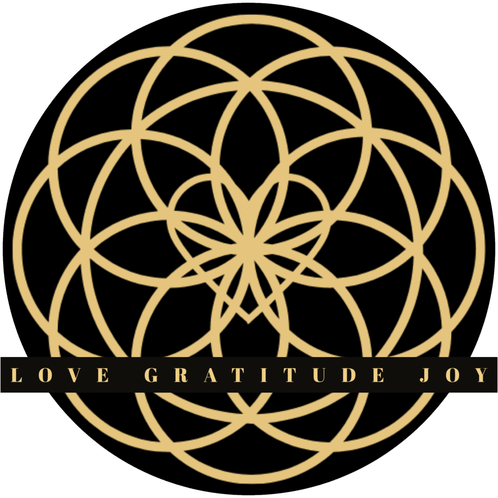 Gold sacred geometry symbol with overlapping circles and a central starburst, featuring the words "Love Gratitude Joy" in gold text on a black band