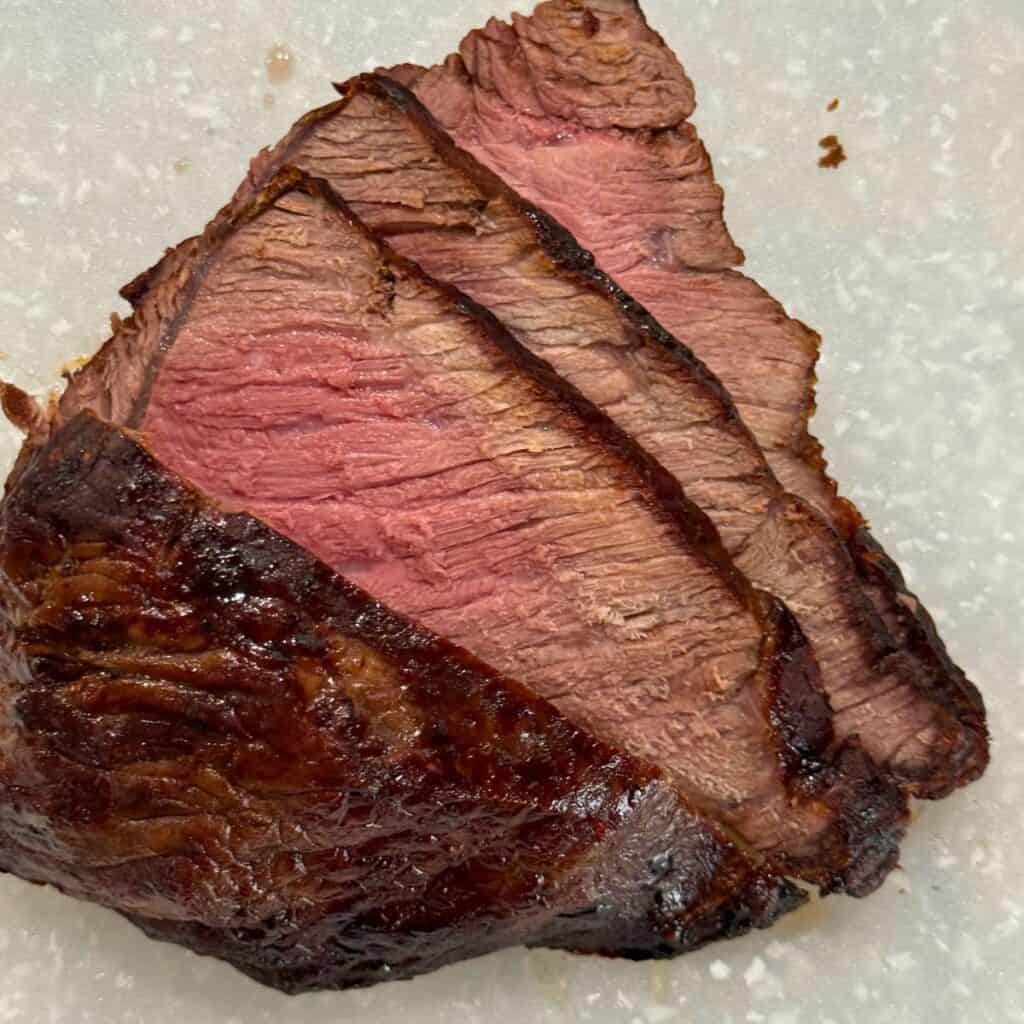 Perfectly cooked medium steak sliced for Jack, made in the Tastee air fryer